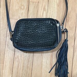 Pour La Victoire Leather Navy Croc-Embossed Crossbody Bag with leather tassel.